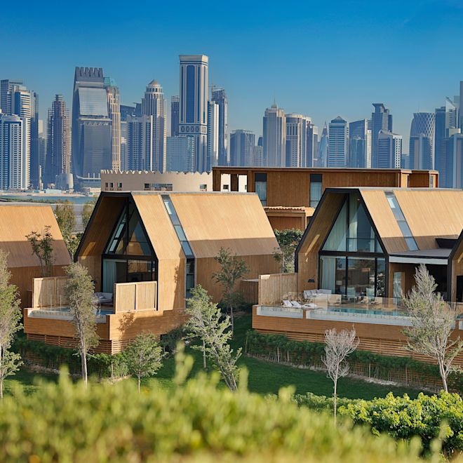Hotel Exterior and View of a Large City in Background
