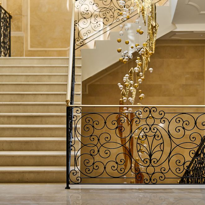 lobby area with staircase and chandelier