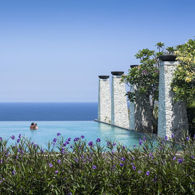 Outdoor infinity pool with guests
