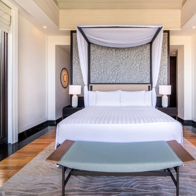 Bed in room with table in foreground