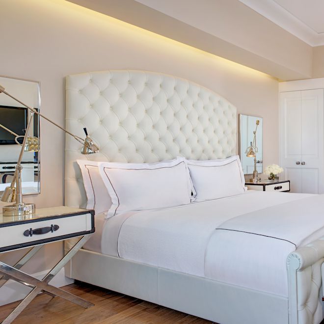 Bed in room with view through to bathroom