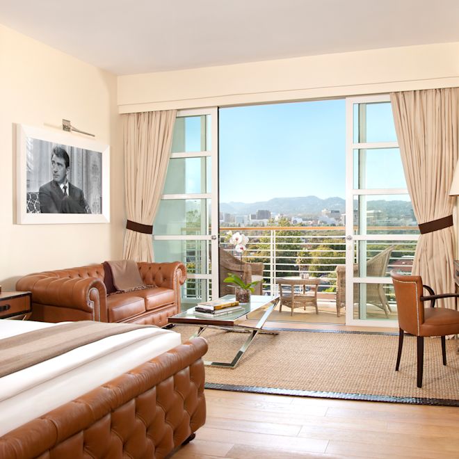 Bed in room with view of lounge area