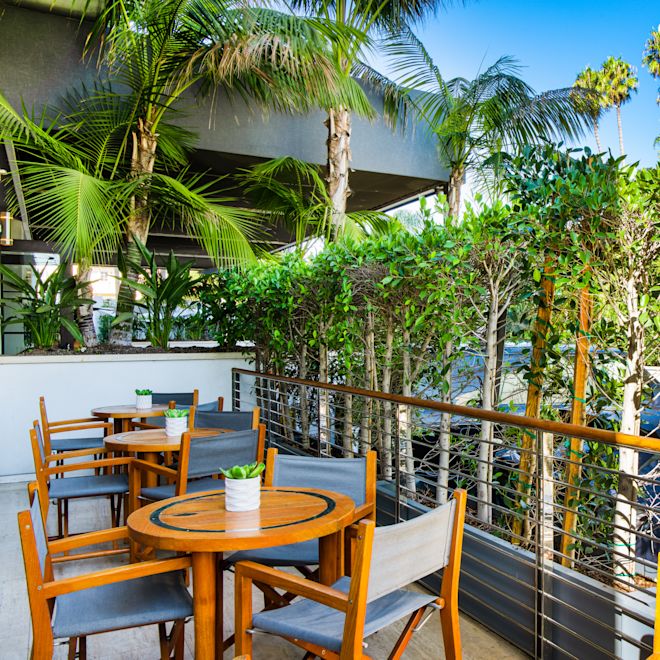 Outdoor seating area with tables and chairs