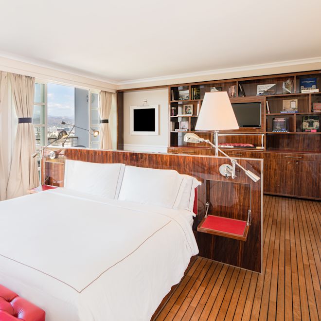 Bed in room with lamps