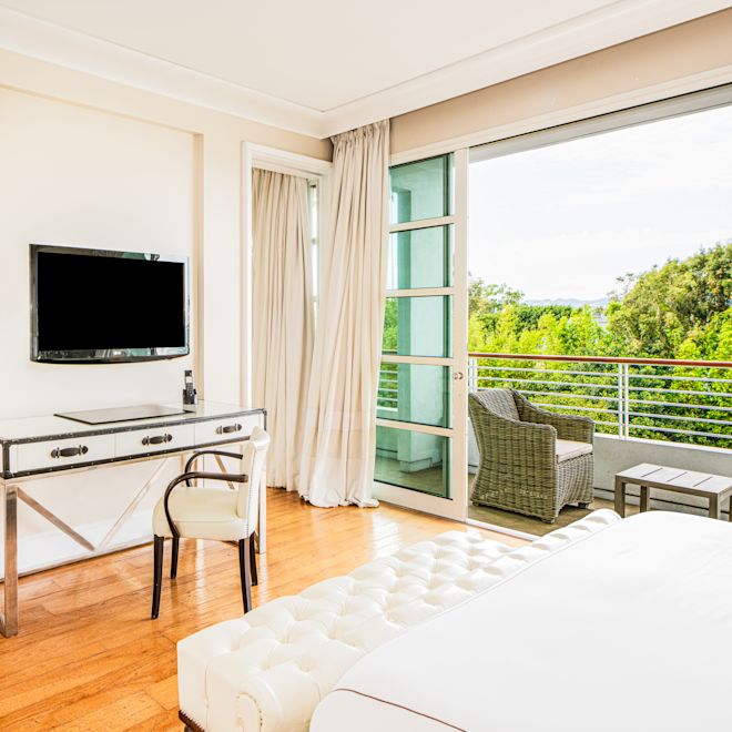 Bedroom with work desk and TV