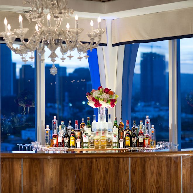 Bar area with drink options and chandelier