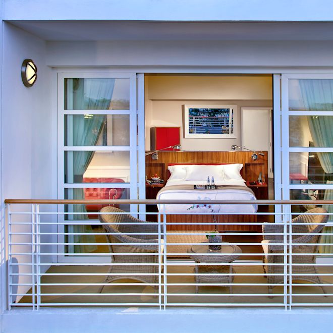 Balcony view with bed and chairs
