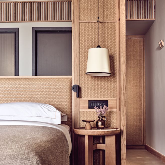 Bed and a Lamp over a Nightstand in a Guest Room