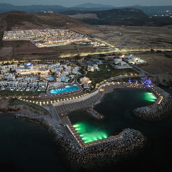 Aerial View of Hotel Exterior in a City in the Evening