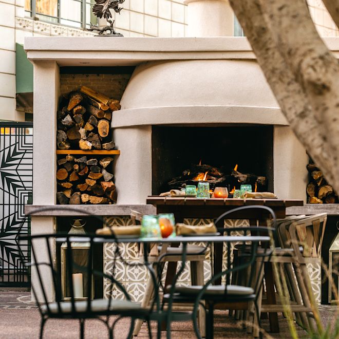 Outdoor seating area with tables and chairs