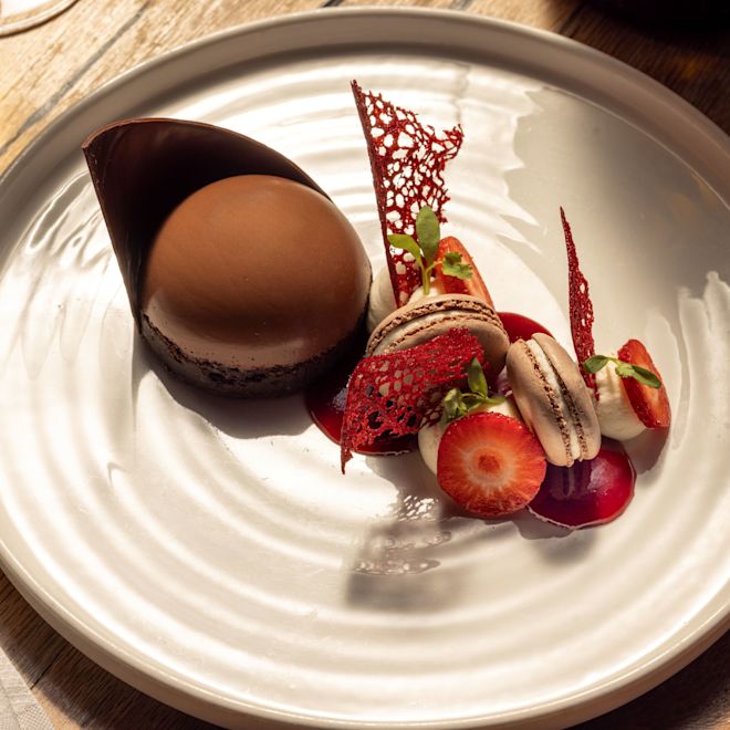 Cookies, Cake and Strawberry Dessert on a Plate at Signature Restaurant