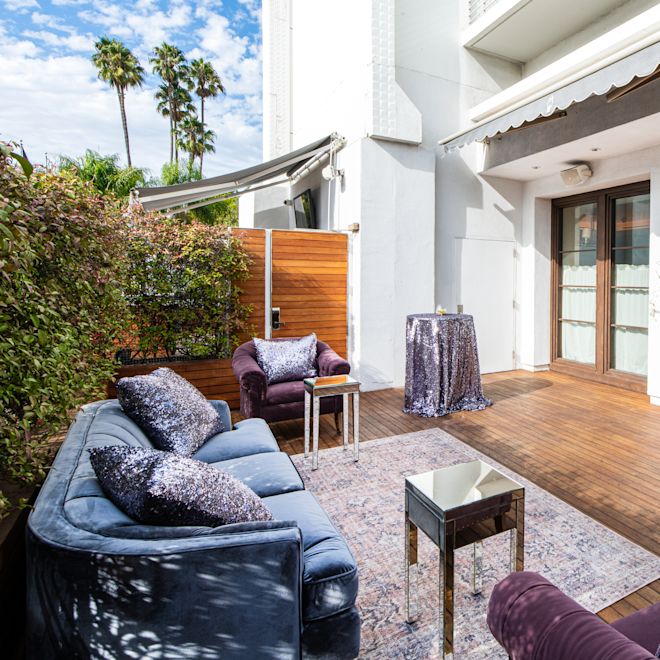 Meeting Area in a Patio with Sofa and Soft Chairs