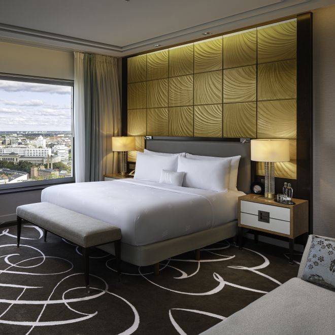 Bed in room with lamps