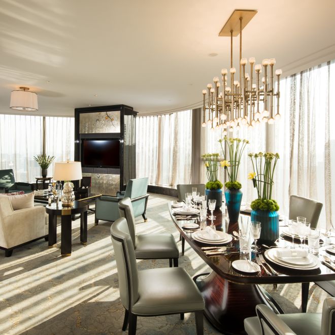 Presidential Suite Lounge Area with Dining Table, Chairs, Sofa and Wall Mounted HDTV