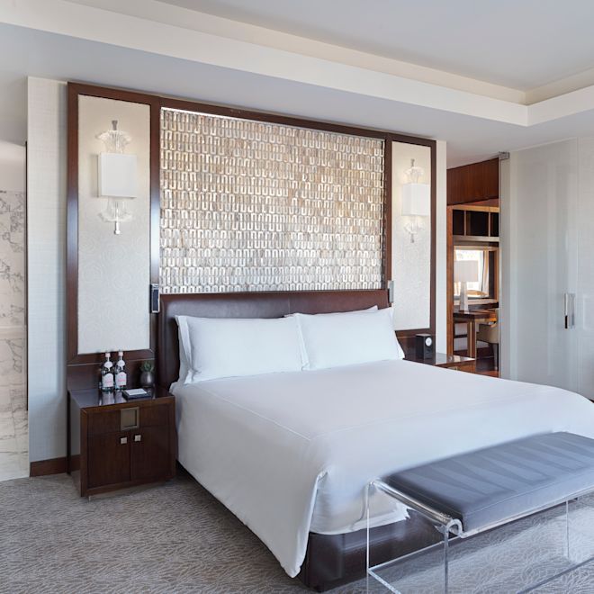 Guestroom with bed and seating area