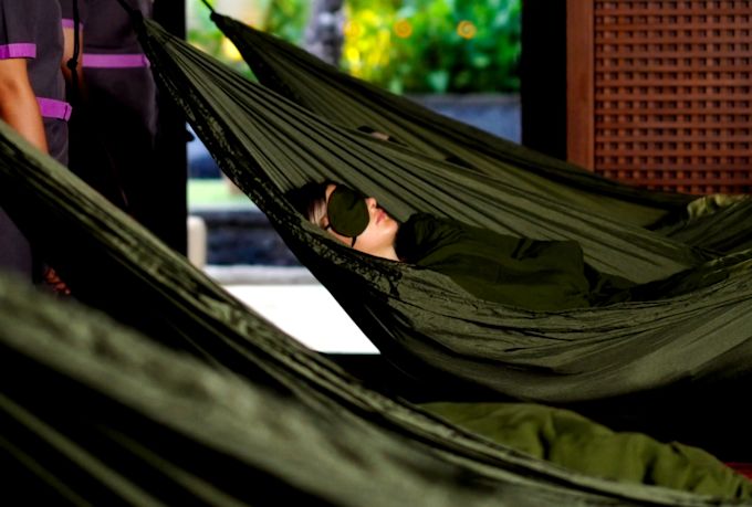 People Relaxing in Hammocks