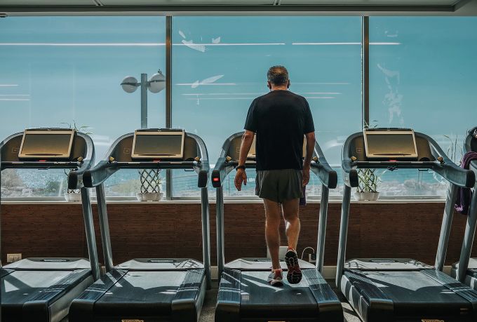 Man working out on a treadmill at the gym