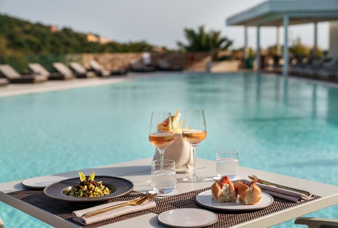 Food on a table at Bioaquam, our poolside restaurant and café