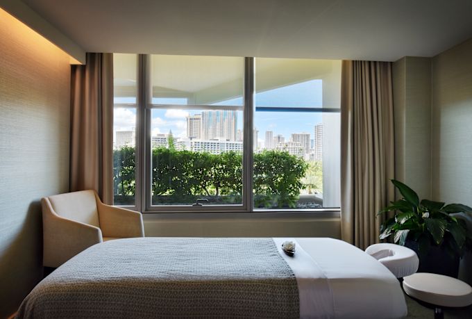 Spa treatment table with comfortable seat