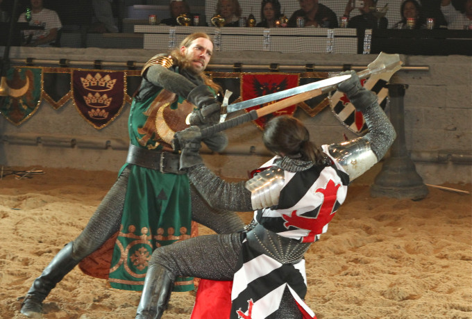 Two medieval knights swordfighting at show