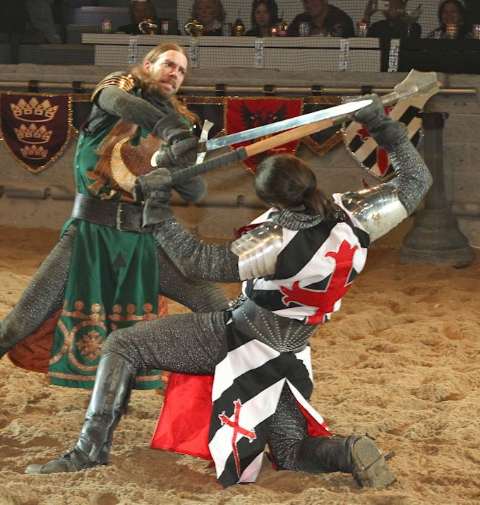 Two medieval knights swordfighting at show