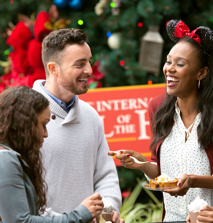 two couples having a snacks and drinks at disney land