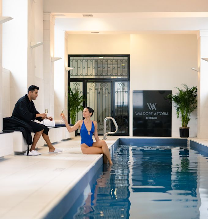 Couple Having a Drink in Indoor Pool Area