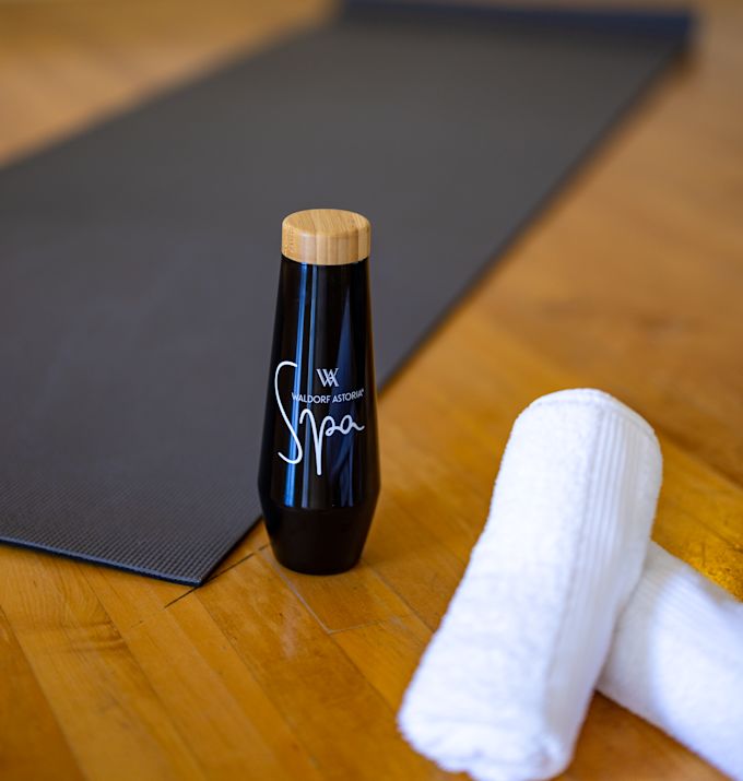 spa, yoga mat, towels, water bottle