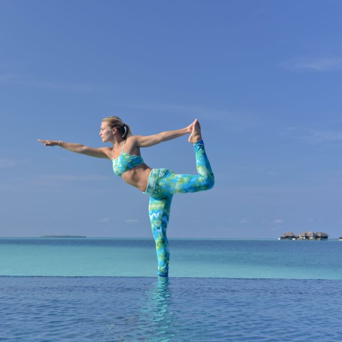 Woman Excerising On Beach