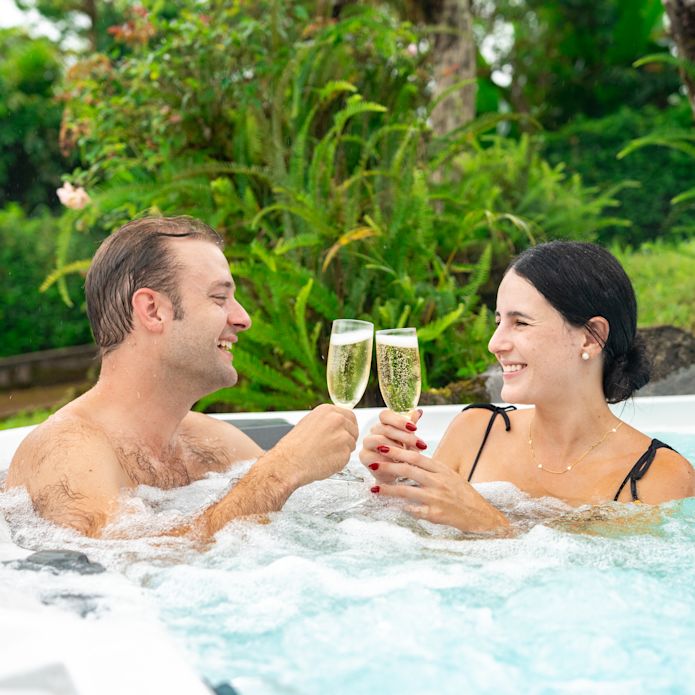 a Couple Enjoying Drinks in a Hot Tub