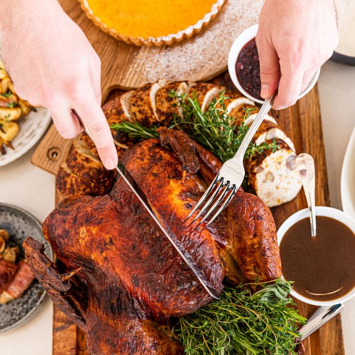 Top down view of Thanksgiving turkey and food setup