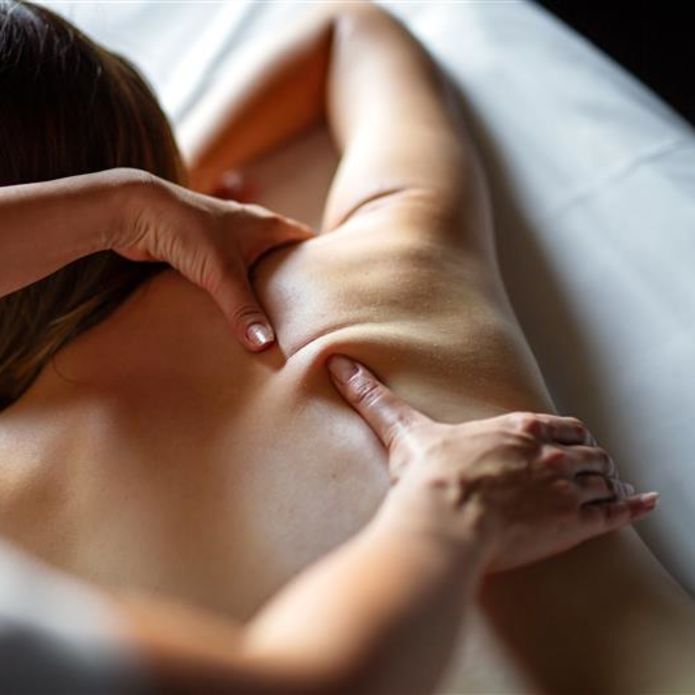Woman receiving back massage