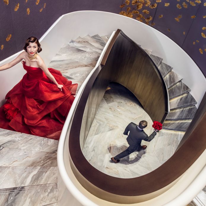 Bride and Groom on a Spiral Staircase on Their Wedding Day