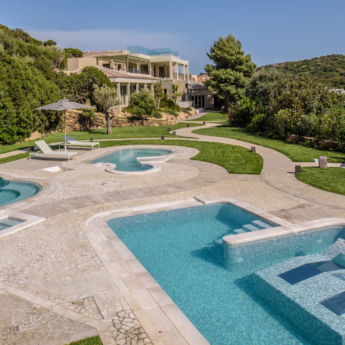 Spa outdoor pool area with loungers