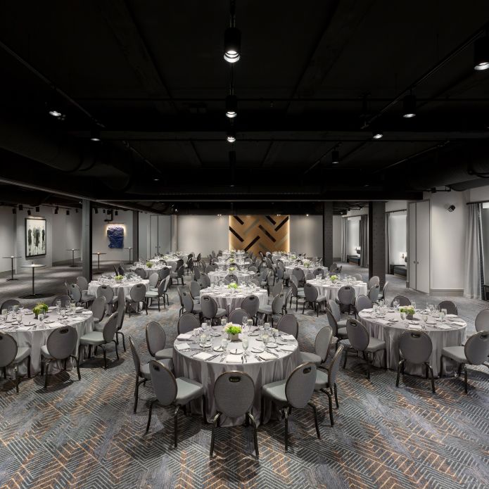 Avenue 34 meeting room with tables and chairs
