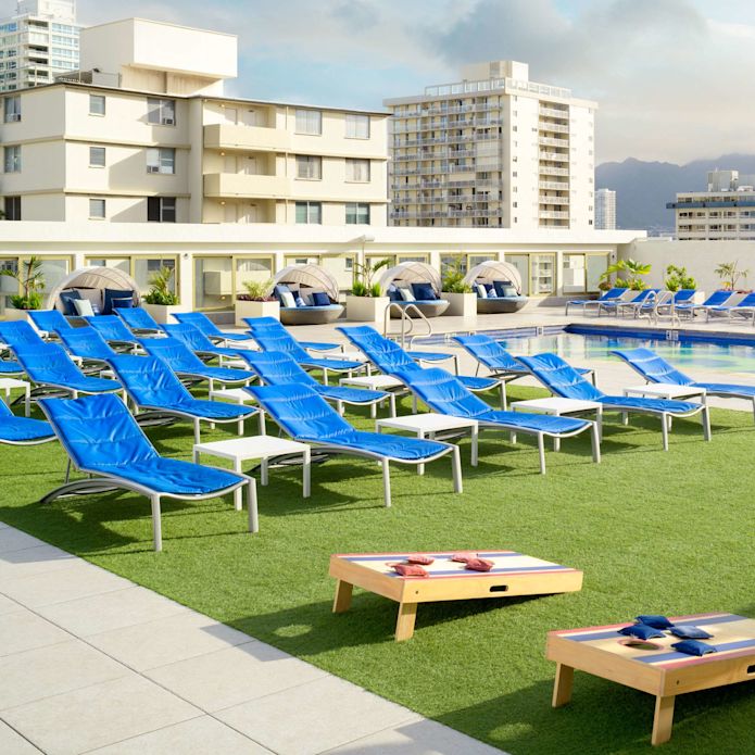 outdoor pool, lounge chairs, lawn games
