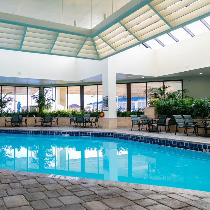 Indoor pool with tables and chairs