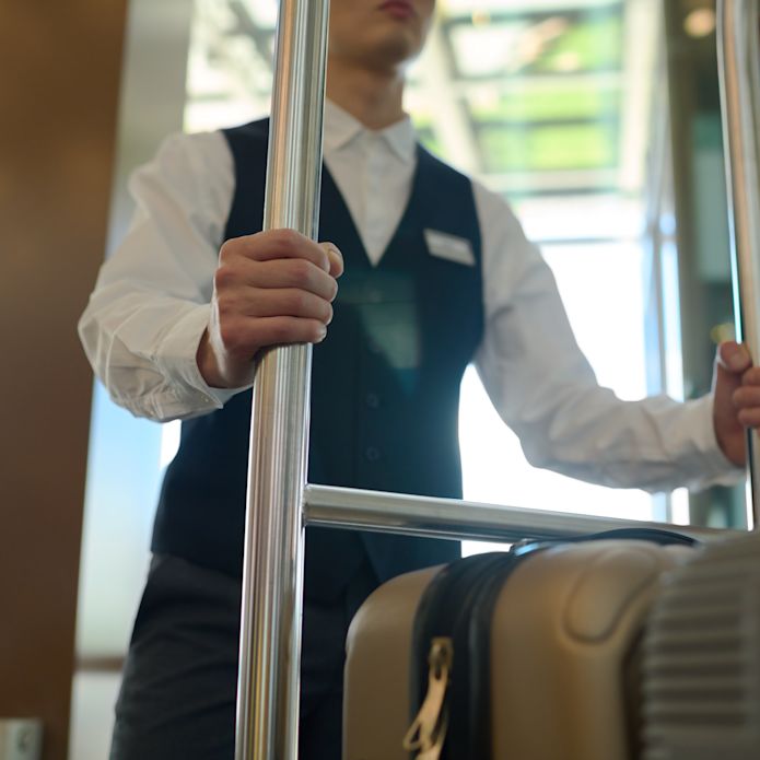 hotel staff moving bags