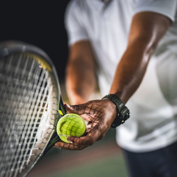 person holding racket