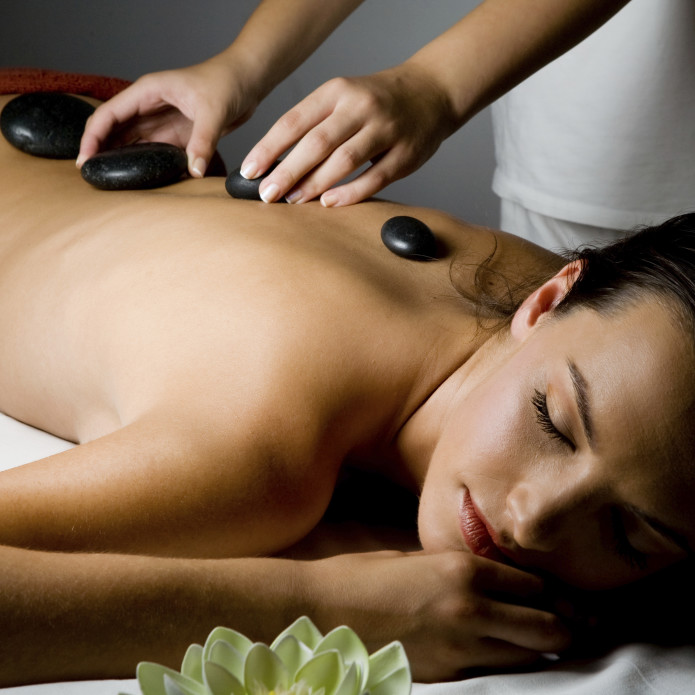 Woman Getting a Hot Stone Massage