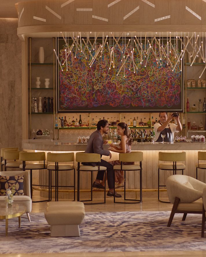 couple sitting by bar