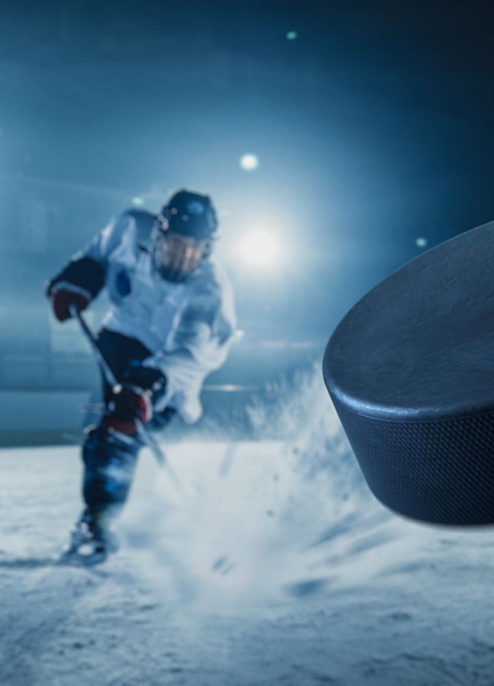 Professional player shooting the puck with hockey stick