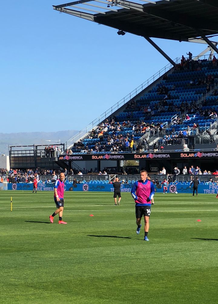 Football players on pitch warming up