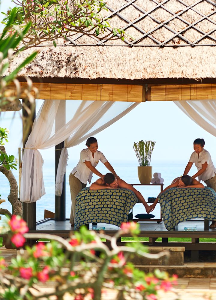 Couple on Massage Beds in Outdoor Spa Hut