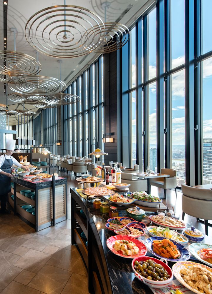 Atmos restaurant, server preparing the lunch and dinner buffet