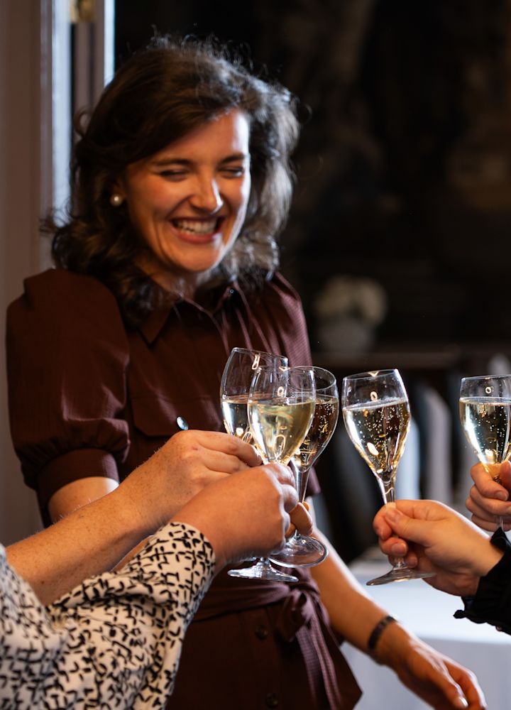People Celebrating with Champagne at the Versailles Suite Meeting Room