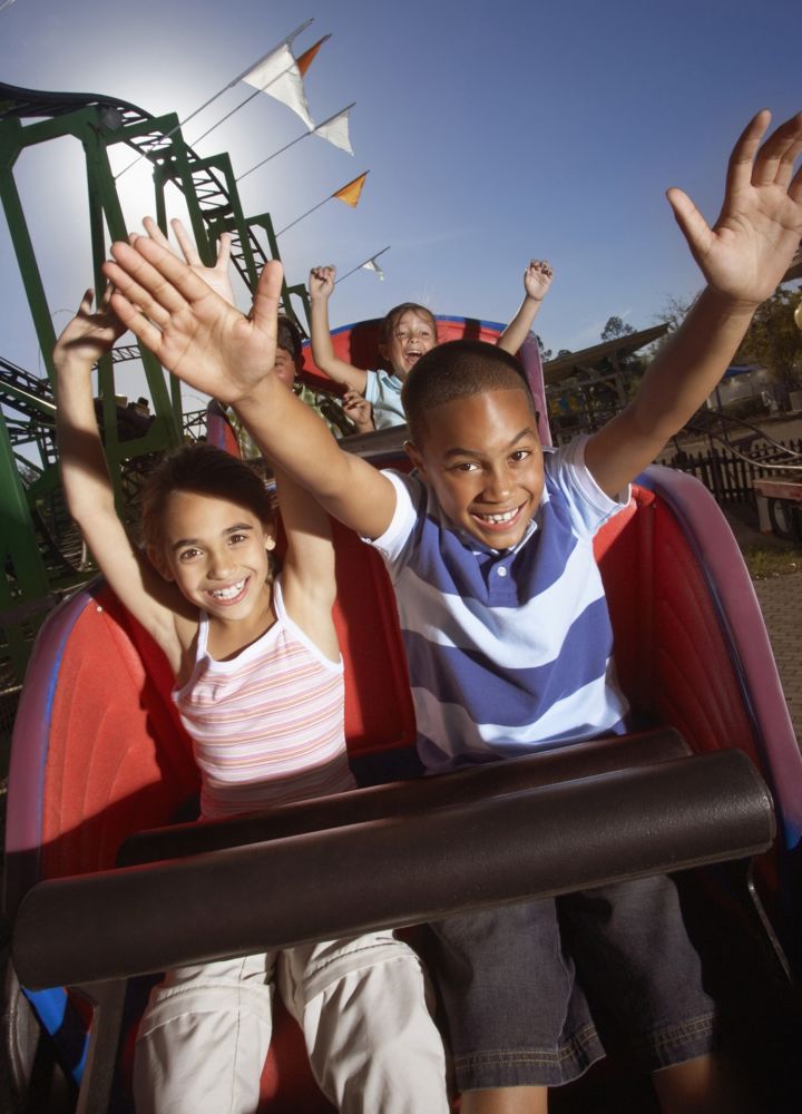 Kids Riding A Roller Coaster