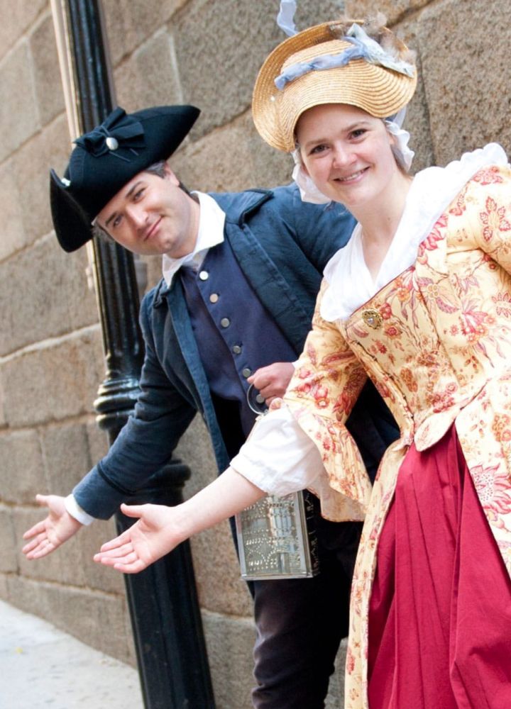 People Wearing Historical Costumes Welcoming Guests to Freedom Trail