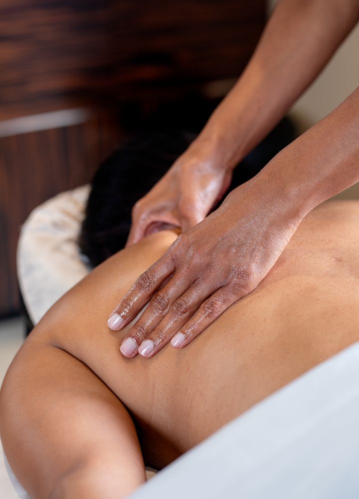 Woman getting a massage at the Spa.