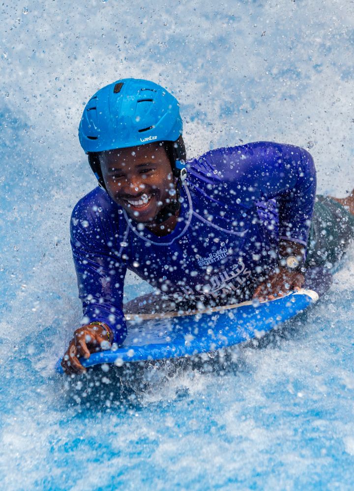 Man on sur board in waves